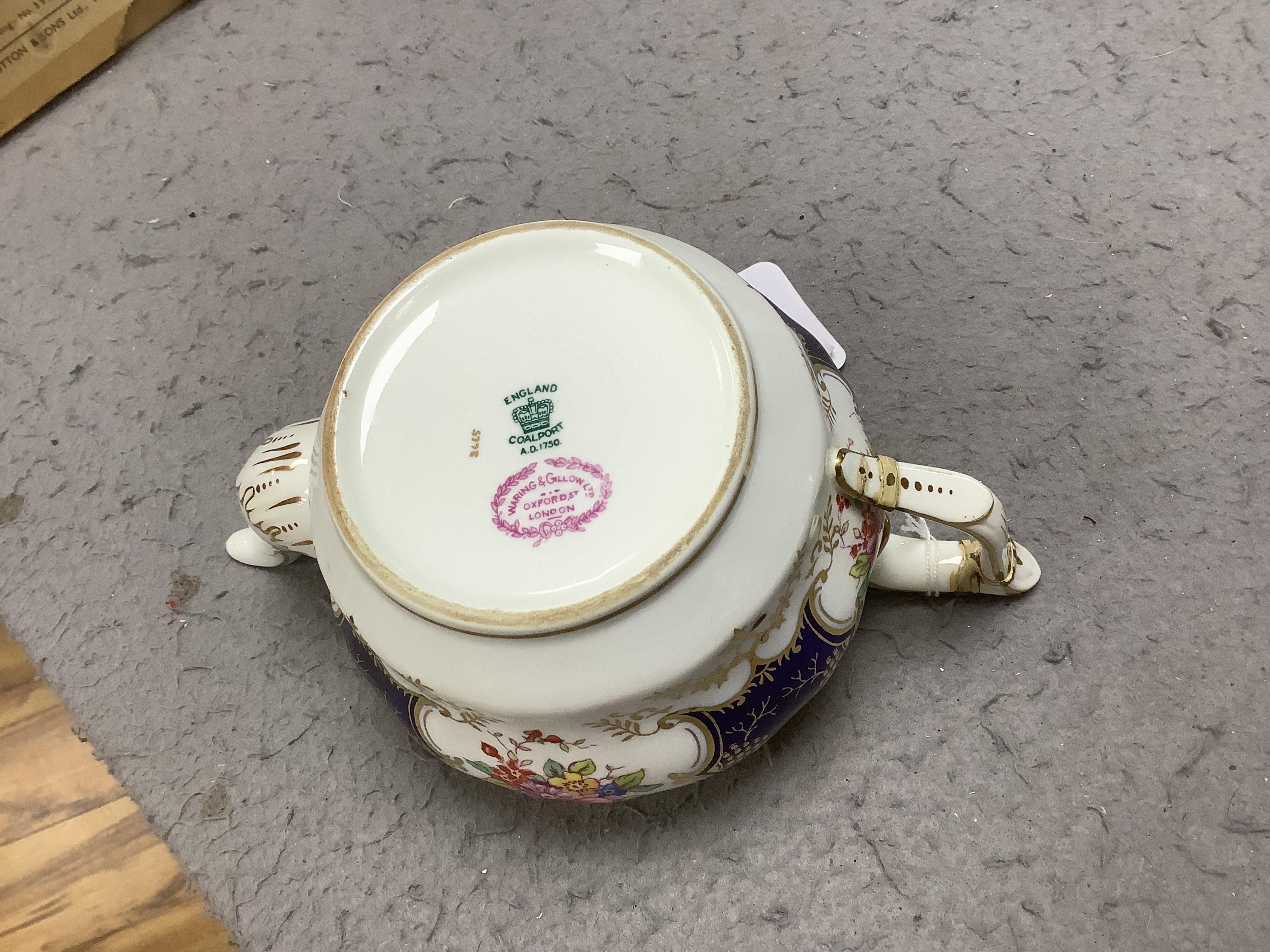 A late 19th/early 20th century Coalport blue and gilt bordered floral painted part tea and dessert service, largest 32cm wide. Condition - varies